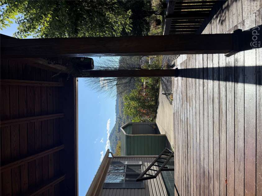97 Fair Haven Drive, Burnsville, NC 28714.  MLS# CAR4433104, YatesRealty ID 56186. Larged covered front porch