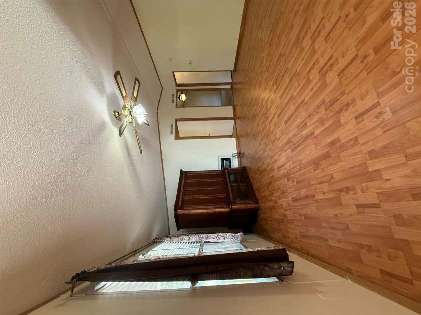97 Fair Haven Drive, Burnsville, NC 28714.  MLS# CAR4433104, YatesRealty ID 56186. Open living room with vaulted ceilings