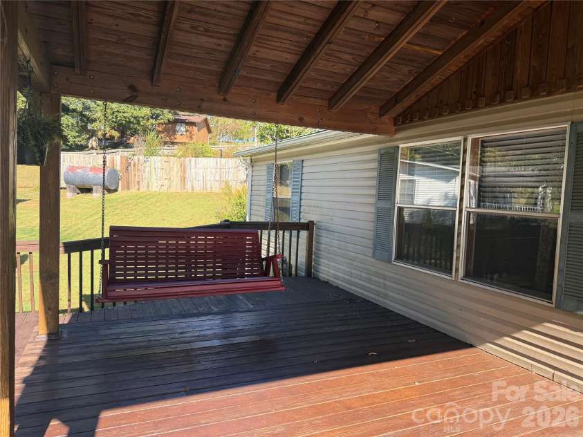 97 Fair Haven Drive, Burnsville, NC 28714.  MLS# CAR4433104, YatesRealty ID 56186. Porch swing