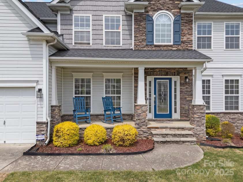 8453 Mossy Cup Trail, Harrisburg, NC 28075.  MLS# CAR4245368, YatesRealty ID 5619. Beautiful landscaping and curb appeal