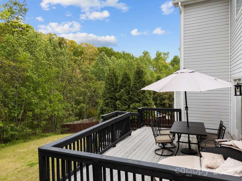 8453 Mossy Cup Trail, Harrisburg, NC 28075.  MLS# CAR4245368, YatesRealty ID 5619. Deck overlooking year yard