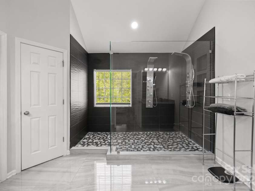 8453 Mossy Cup Trail, Harrisburg, NC 28075.  MLS# CAR4245368, YatesRealty ID 5619. Ensuite primary bath has oversized walk in shower