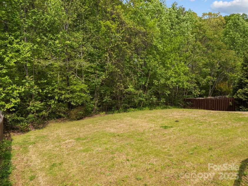 8453 Mossy Cup Trail, Harrisburg, NC 28075.  MLS# CAR4245368, YatesRealty ID 5619. Large private back yard