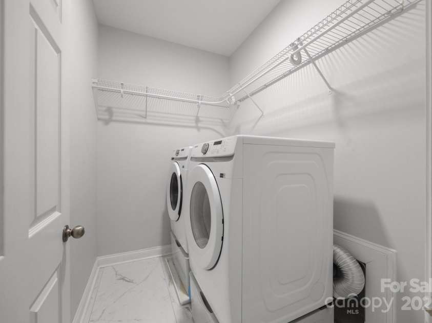 8453 Mossy Cup Trail, Harrisburg, NC 28075.  MLS# CAR4245368, YatesRealty ID 5619. Large walk in laundry off of kitchen and garage