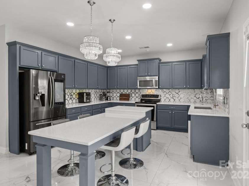 8453 Mossy Cup Trail, Harrisburg, NC 28075.  MLS# CAR4245368, YatesRealty ID 5619. Remodeled kitchen has quartz countertops