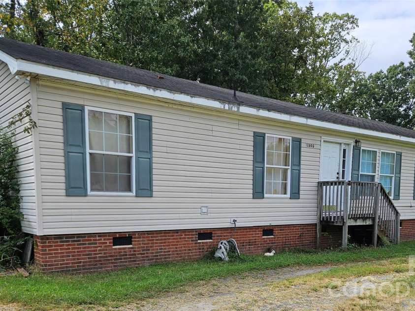 2306 John Street, Matthews, NC 28105.  MLS# CAR4424469, YatesRealty ID 56202. Front of the Home