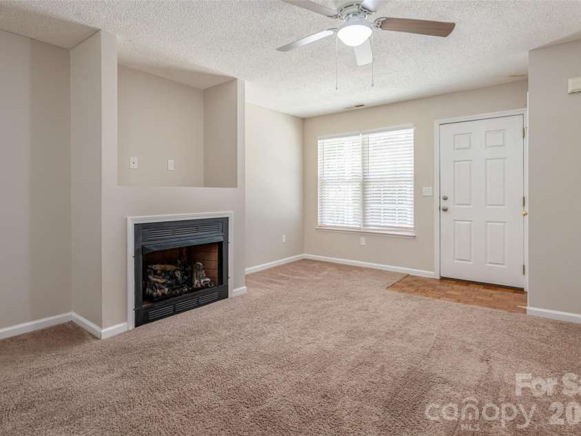 201 Birch Lane, Arden, NC 28704.  MLS# CAR4386730, YatesRealty ID 56230. Large living Room with a Fireplace.