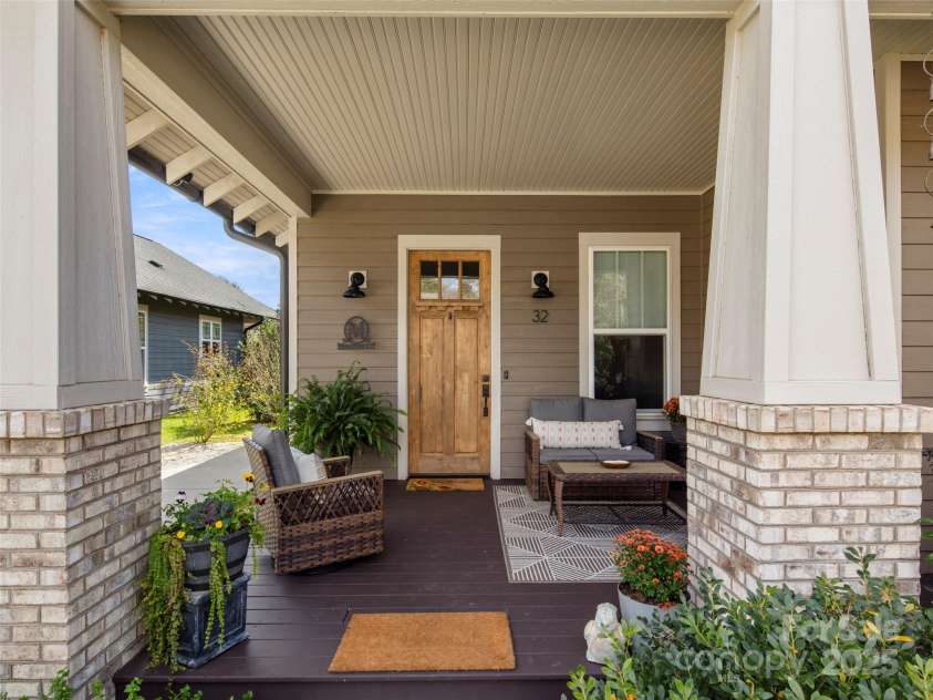 32 Bungalow Way, Brevard, NC 28712.  MLS# CAR4330127, YatesRealty ID 5624. Cozy covered front porch