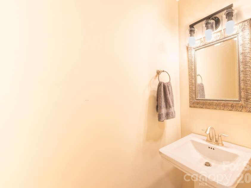 13836 Poppleton Court, Charlotte, NC 28273.  MLS# CAR4433885, YatesRealty ID 56253. Hall half bath on main level