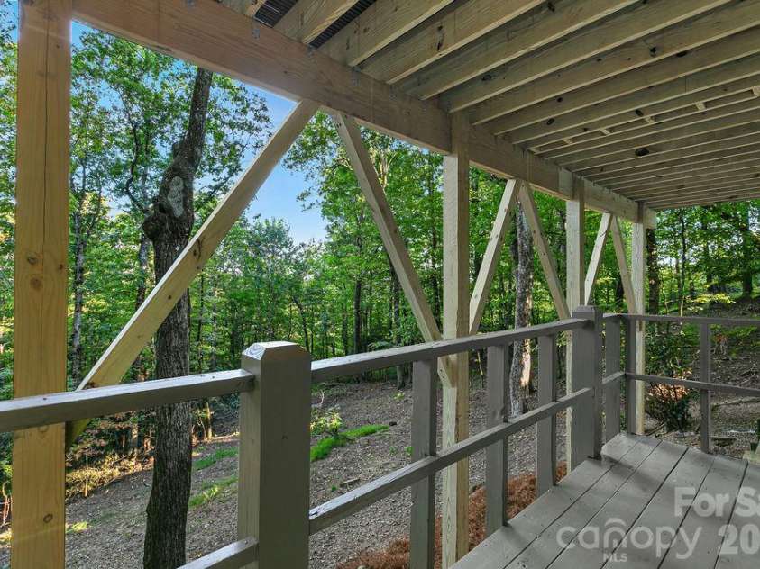 2377 Connestee Trail, Brevard, NC 28712.  MLS# CAR4431214, YatesRealty ID 56257. Covered Lower Deck