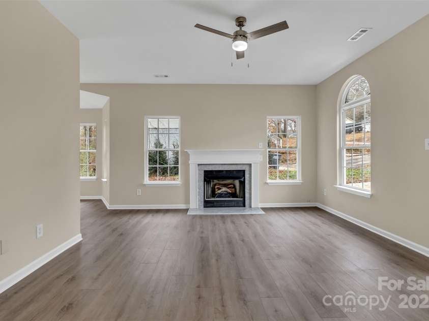 1331 Copper Creek Lane, Fort Mill, SC 29715.  MLS# CAR4326414, YatesRealty ID 5626. Living room with new ceiling fan that opens into the eat-in kitchen area!