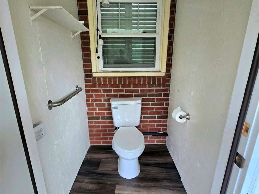 4107 Windwood Drive, Gastonia, NC 28056.  MLS# CAR4433892, YatesRealty ID 56264. Half Bathroom built onto the screen back deck.