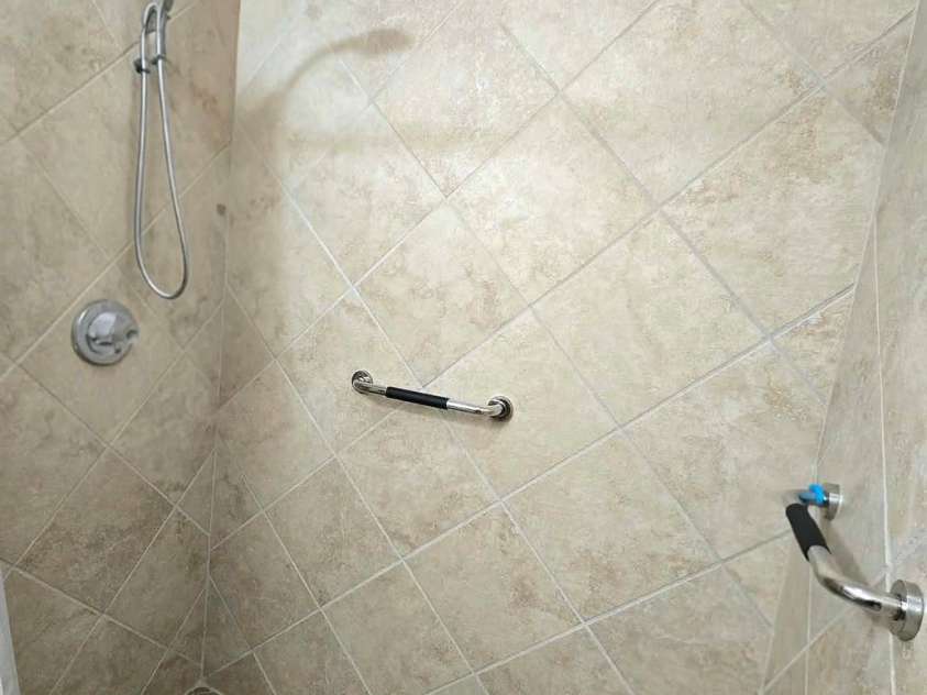 4107 Windwood Drive, Gastonia, NC 28056.  MLS# CAR4433892, YatesRealty ID 56264. Tile walk-in shower with built-in seat