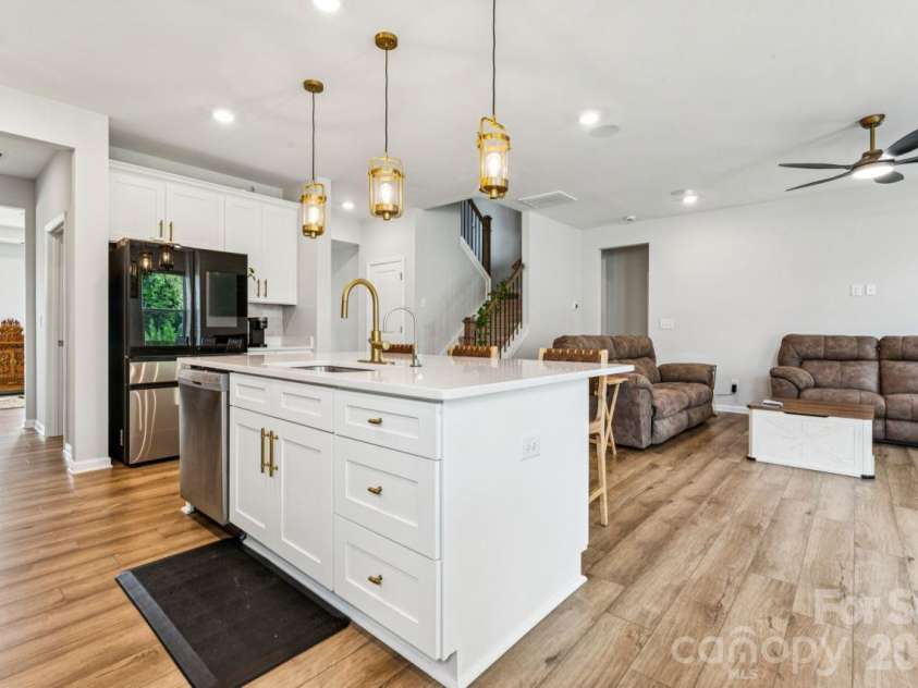 8704 Frank Grier Road, Charlotte, NC 28215.  MLS# CAR4433413, YatesRealty ID 56267. Kitchen and living room