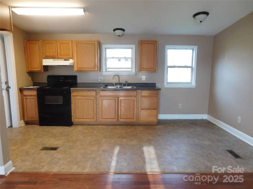 1909 Lawyers Road, Monroe, NC 28110.  MLS# CAR4234355, YatesRealty ID 5627. Kitchen view from living room