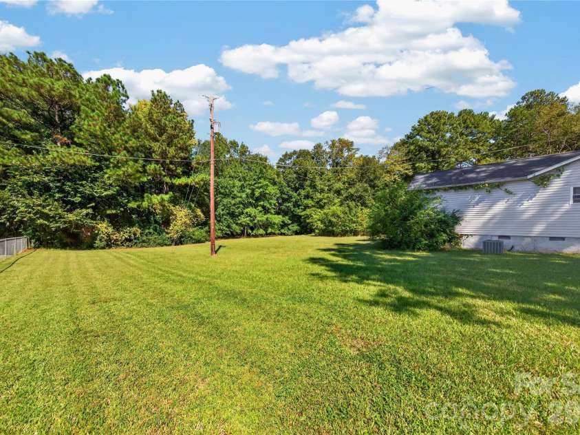 7572 Charlotte Highway, Indian Land, SC 29707.  MLS# CAR4430507, YatesRealty ID 56272. Backyard