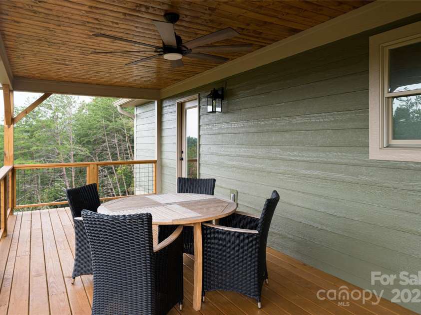 181 Flint Morgan Road, Mars Hill, NC 28754.  MLS# CAR4288459, YatesRealty ID 5628. Covered Back Deck with private Primary Suite Access