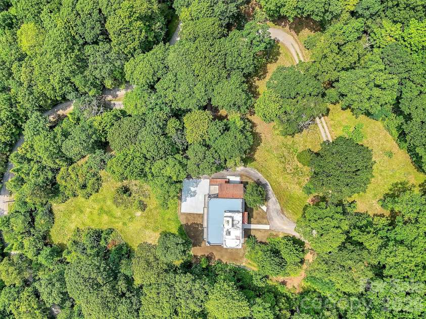 2222 Greenspire Drive, Sylva, NC 28779.  MLS# CAR4159278, YatesRealty ID 5629. Drone view.