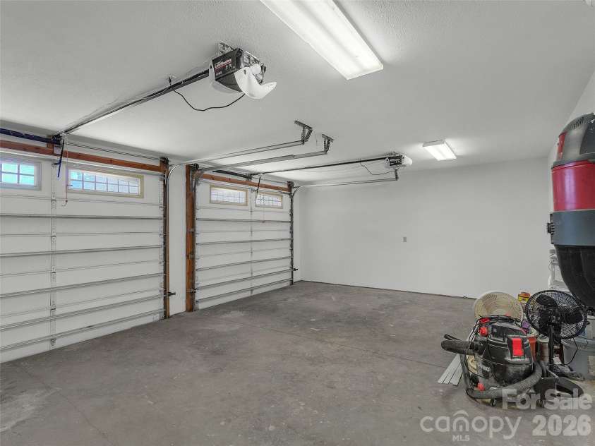 2222 Greenspire Drive, Sylva, NC 28779.  MLS# CAR4159278, YatesRealty ID 5629. Garage area.