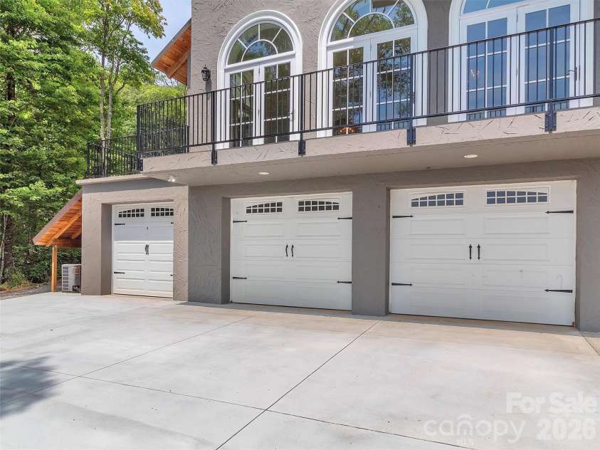 2222 Greenspire Drive, Sylva, NC 28779.  MLS# CAR4159278, YatesRealty ID 5629. Garage entrance.