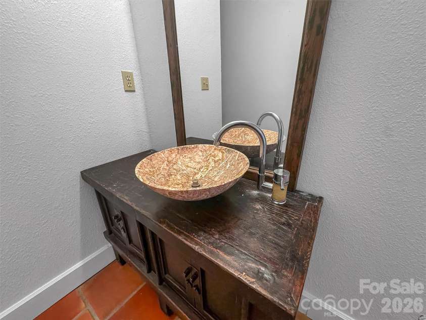 2222 Greenspire Drive, Sylva, NC 28779.  MLS# CAR4159278, YatesRealty ID 5629. Multiple antique vanities.