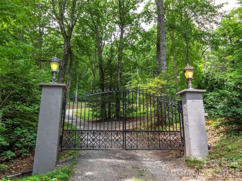 2222 Greenspire Drive, Sylva, NC 28779.  MLS# CAR4159278, YatesRealty ID 5629. Private gate.