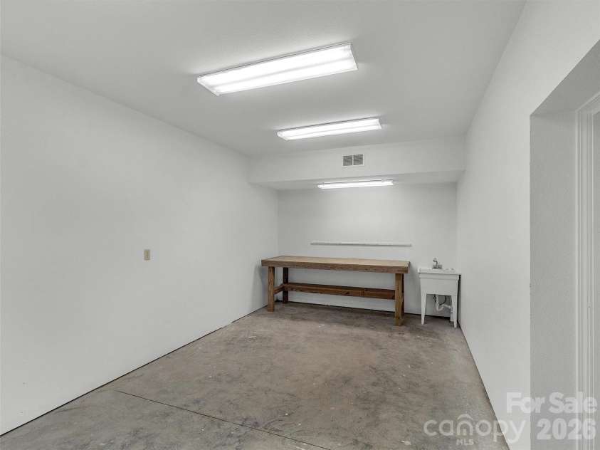 2222 Greenspire Drive, Sylva, NC 28779.  MLS# CAR4159278, YatesRealty ID 5629. Workshop designed to double as a walk-in safe.