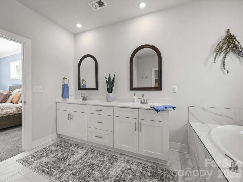 1305 Coppergate Drive, Salisbury, NC 28147.  MLS# CAR4428820, YatesRealty ID 56314. Double vanity, large soaking tub and upright shower