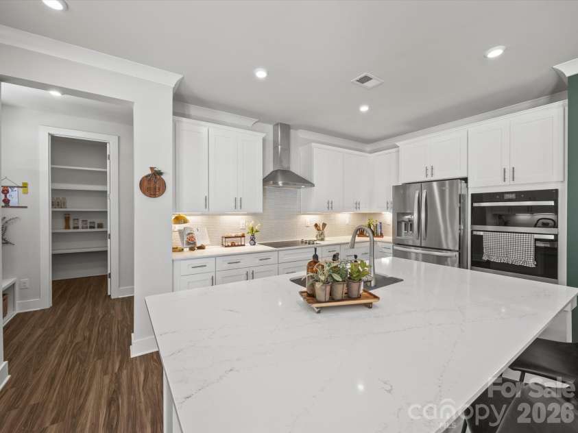 1305 Coppergate Drive, Salisbury, NC 28147.  MLS# CAR4428820, YatesRealty ID 56314. Walk in pantry with wood shelving right off kitchen