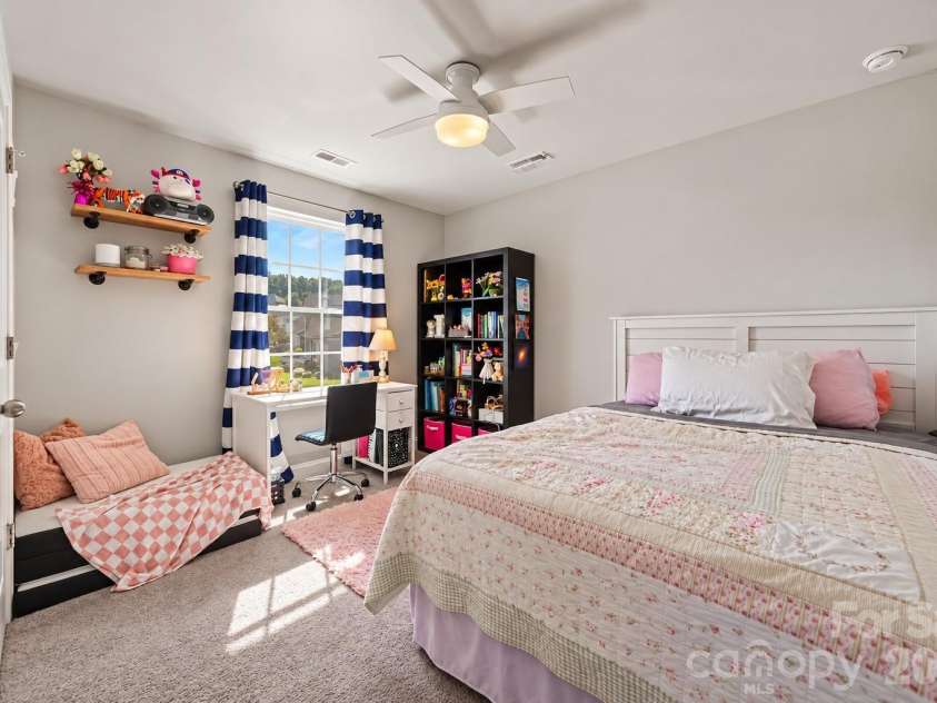 2703 Wedgewood Court, Denver, NC 28037.  MLS# CAR4428262, YatesRealty ID 56317. A bright secondary bedroom filled with natural light.