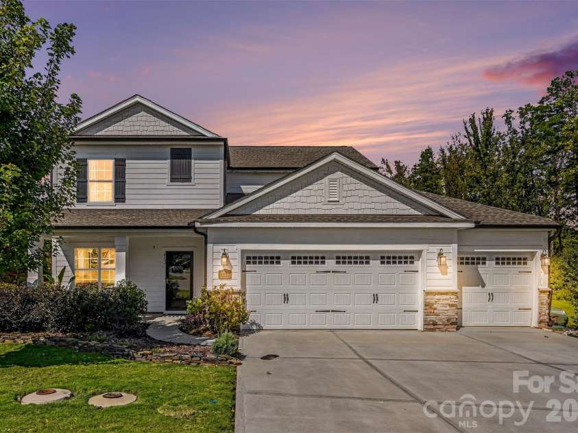 2703 Wedgewood Court, Denver, NC 28037.  MLS# CAR4428262, YatesRealty ID 56317. Glowing at twilight, this home makes quite the first impression.