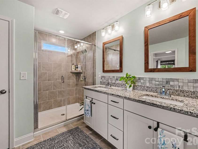 2703 Wedgewood Court, Denver, NC 28037.  MLS# CAR4428262, YatesRealty ID 56317. Tile accents, framed mirrors, and space to get ready side by side.