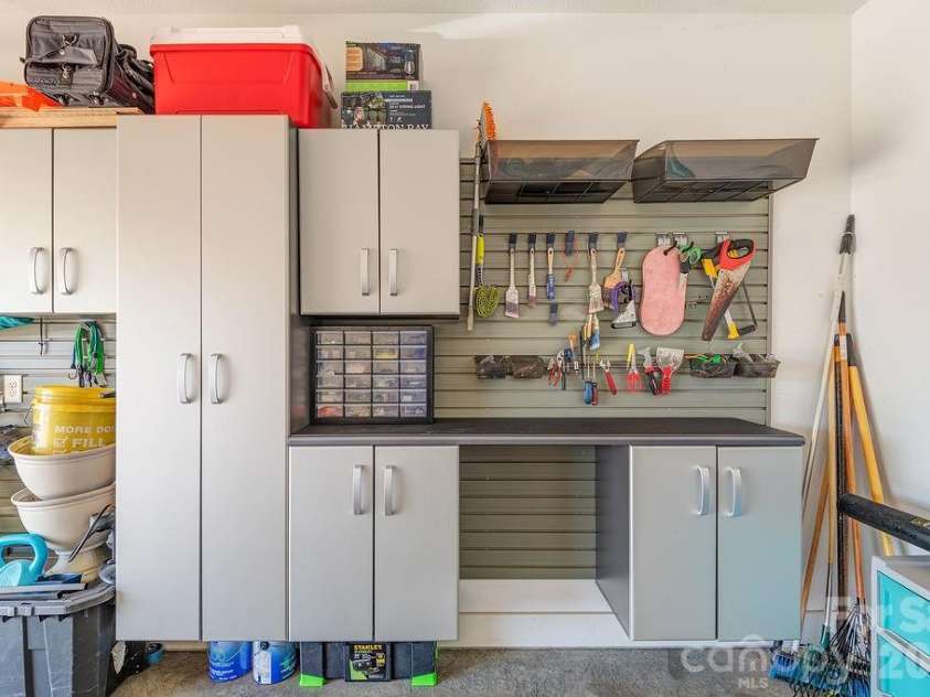16 Holland Mountain View, Asheville, NC 28804.  MLS# CAR4342286, YatesRealty ID 5632. Additional storage & workbench in garage
