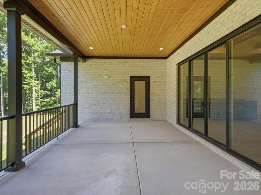 8018 Fairmont Drive, Waxhaw, NC 28173.  MLS# CAR4276331, YatesRealty ID 5633. Back Covered Porch