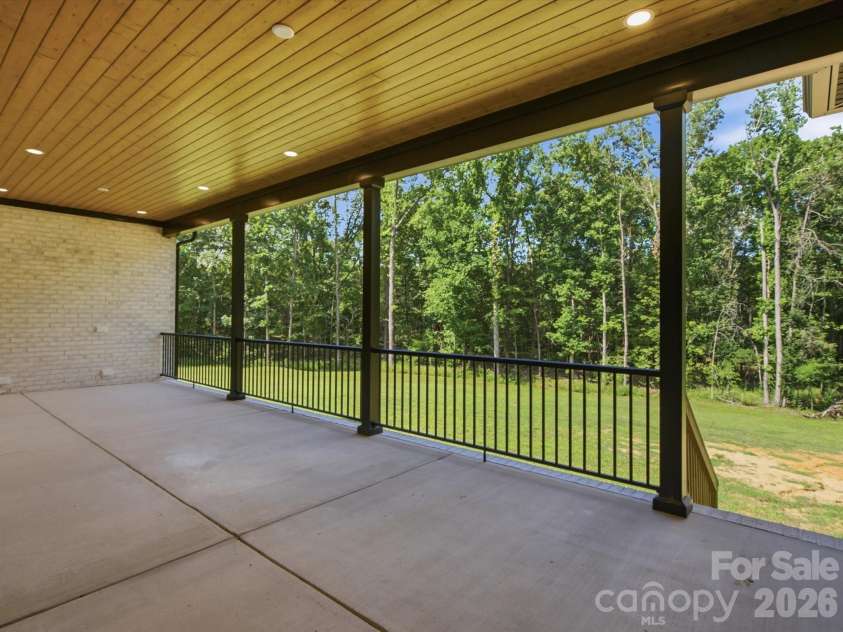 8018 Fairmont Drive, Waxhaw, NC 28173.  MLS# CAR4276331, YatesRealty ID 5633. Covered back porch