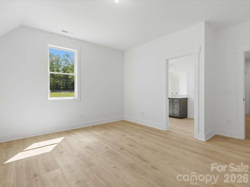 8018 Fairmont Drive, Waxhaw, NC 28173.  MLS# CAR4276331, YatesRealty ID 5633. Upper Guest Bedroom