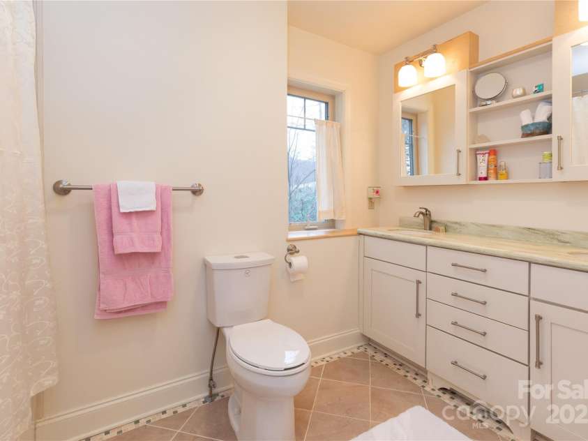 20 Lila Lane, Clyde, NC 28721.  MLS# CAR4231979, YatesRealty ID 5639. Downstairs Bathroom