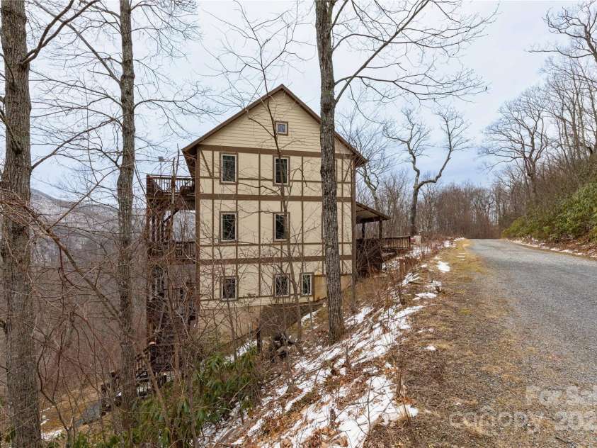 20 Lila Lane, Clyde, NC 28721.  MLS# CAR4231979, YatesRealty ID 5639. Side of Home