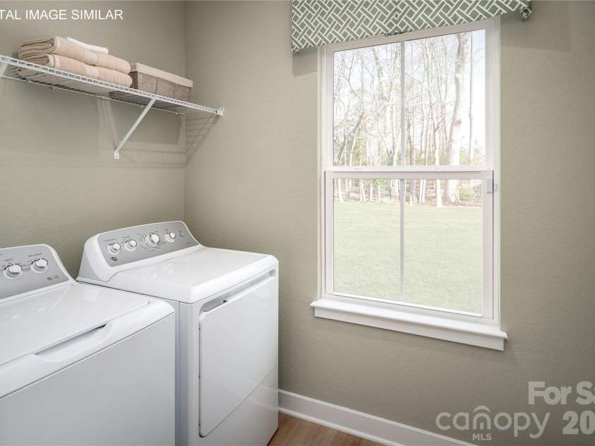 11161 Emerson Landing Drive, Charlotte, NC 28214.  MLS# CAR4390980, YatesRealty ID 56392. First-floor laundry room with optional utility sink—conveniently located for everyday use.