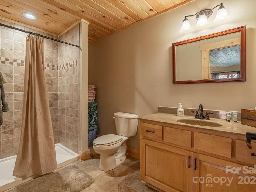 1143 Grandview Peaks Drive, Nebo, NC 28761.  MLS# CAR4329247, YatesRealty ID 564. Full Basement Bathroom