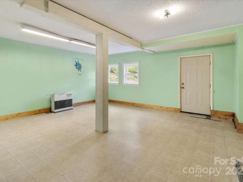 461 Tweed Road, Madison, NC 28753.  MLS# CAR4267871, YatesRealty ID 564. Old flooring in bonus room