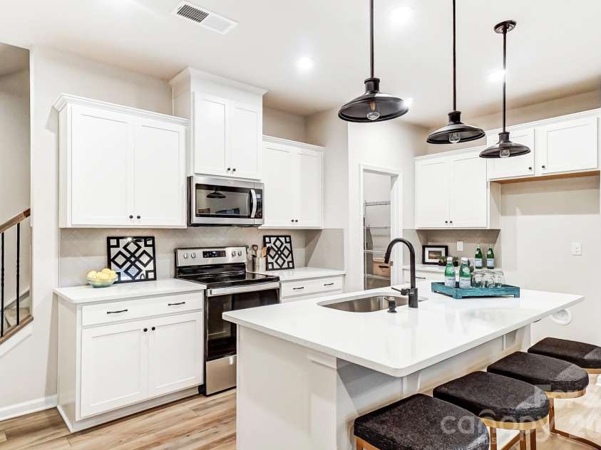 5209 Wyes Oak Lane, Charlotte, NC 28269.  MLS# CAR4434407, YatesRealty ID 56449. Photos are representative
