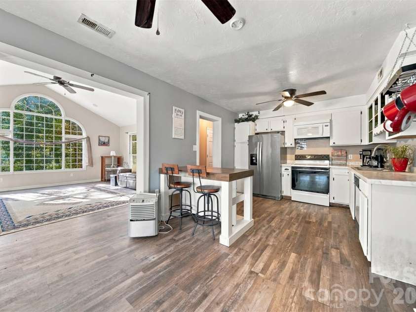 183 Falls Avenue, Granite Falls, NC 28630.  MLS# CAR4433129, YatesRealty ID 56476. Guest House Kitchen and Living room