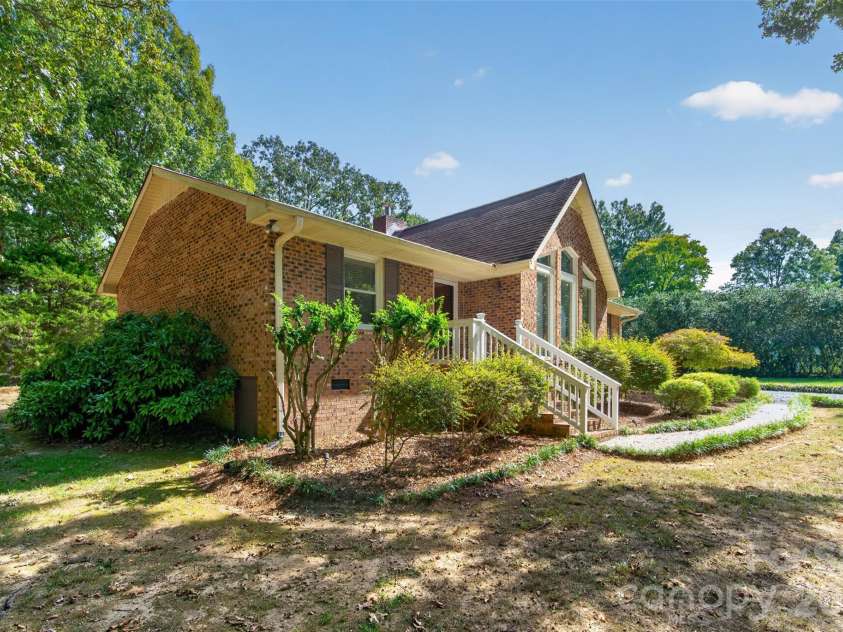 2209 Rainbrook Drive, Monroe, NC 28112.  MLS# CAR4432727, YatesRealty ID 56489. Side view large lot
