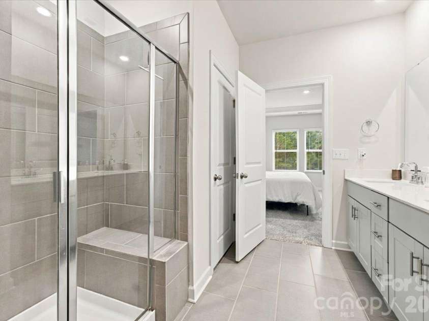 7722 Porrera Street, Charlotte, NC 28214.  MLS# CAR4434037, YatesRealty ID 56499. Primary bathroom.
