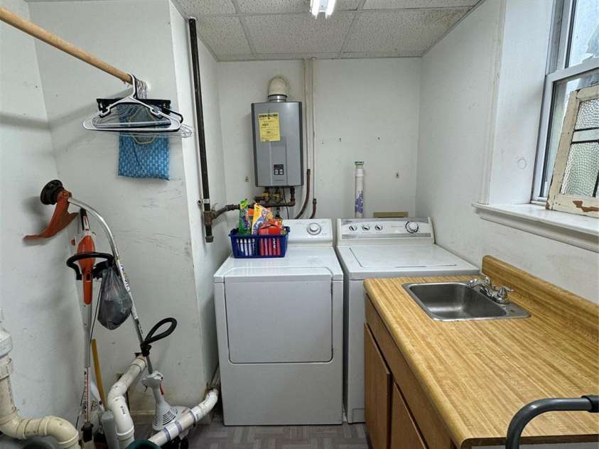 510 Collett Street, Morganton, NC 28655.  MLS# CAR4193450, YatesRealty ID 5650. Laundry room.  Pump and tankless water heater as well