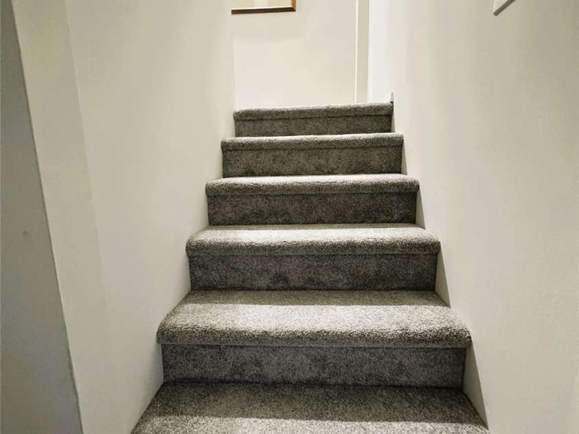 510 Collett Street, Morganton, NC 28655.  MLS# CAR4193450, YatesRealty ID 5650. Stairs leading to basement/downstairs area (new carpet, molding and paint)