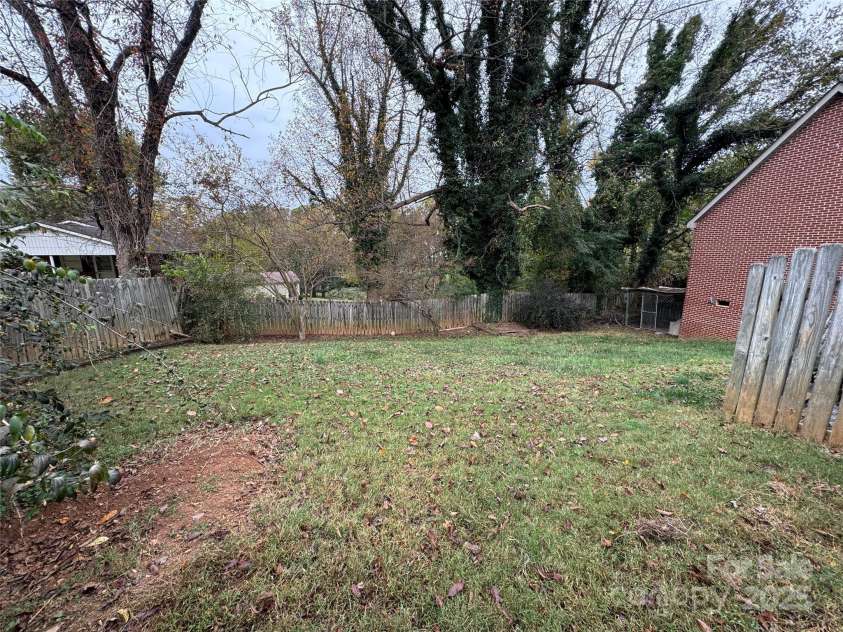 510 Collett Street, Morganton, NC 28655.  MLS# CAR4193450, YatesRealty ID 5650. View of backyard from upper gate