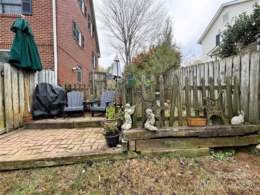 510 Collett Street, Morganton, NC 28655.  MLS# CAR4193450, YatesRealty ID 5650. View of patio and garden area outside of deck