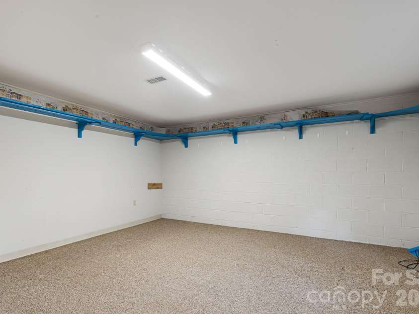 103 Tarragon Place, Flat Rock, NC 28731.  MLS# CAR4432456, YatesRealty ID 56509. Finished room in basement